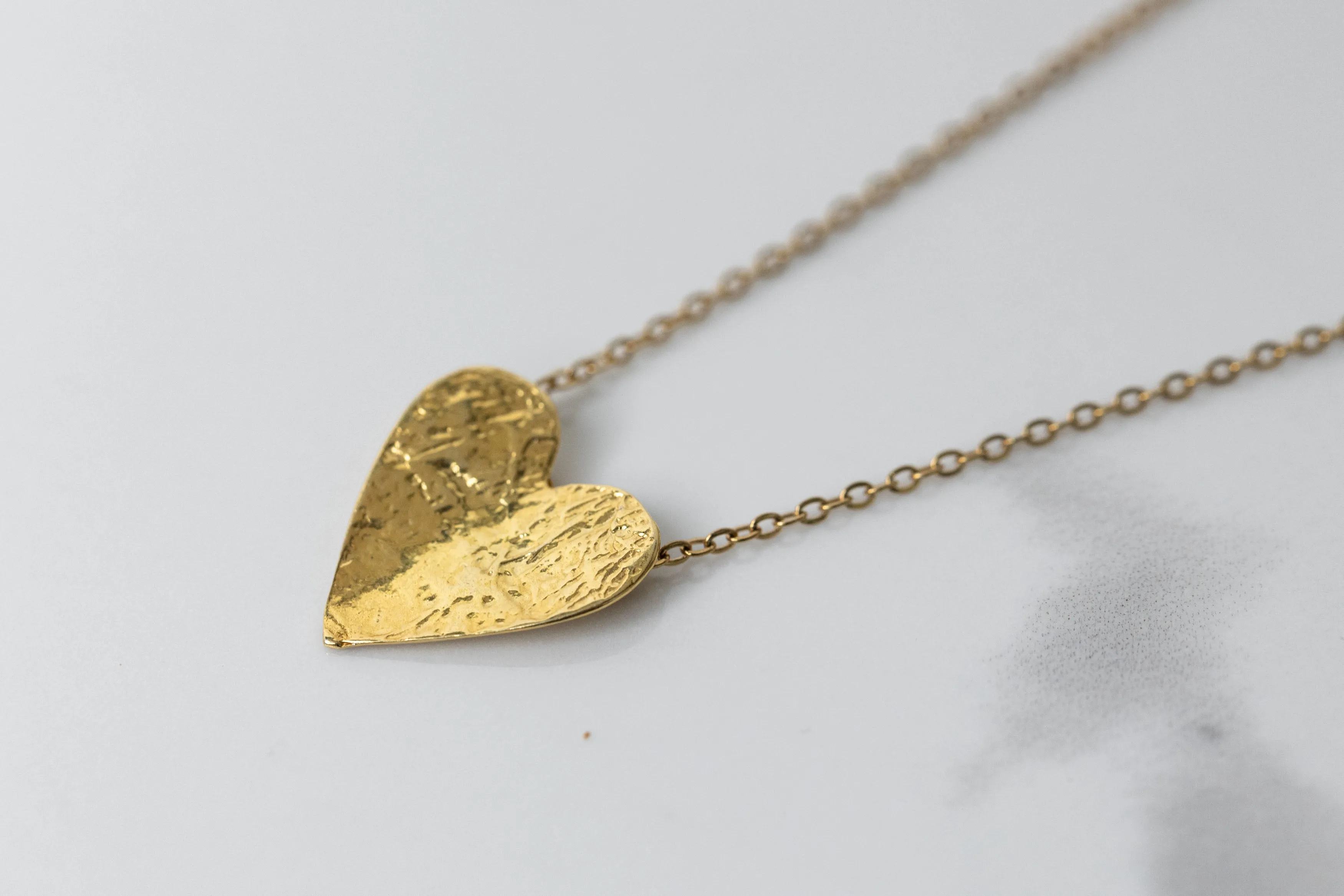 Gold semi-flip heart necklace